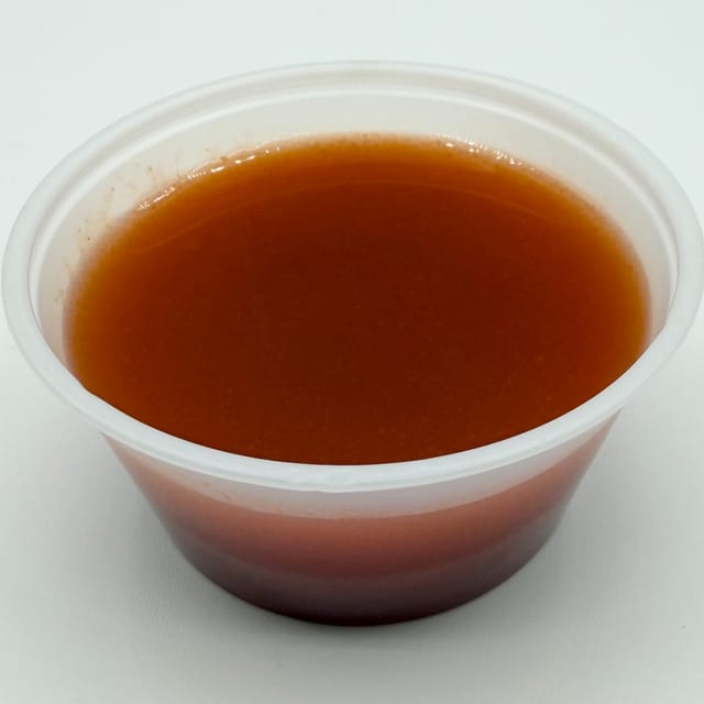Side of Mandee's Regret Hot Sauce.